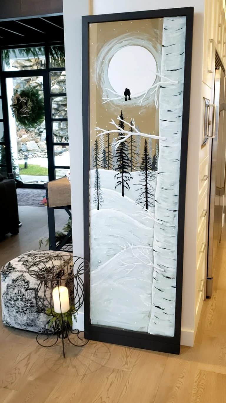 Winter snowy scene painted on a large mirror